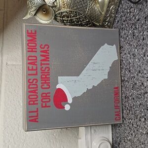 "All roads lead home for Christmas" California wooden sign